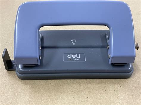 deli  hole puncher sheet lock system adjustable ruler office puncher