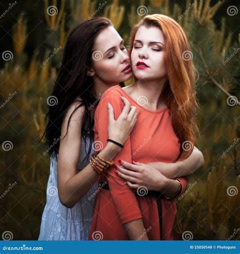 Two Beautiful Girls In The Background Of Spruce Fo Stock Photo Image