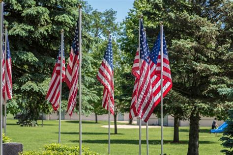 American Flags on Display at War Memorial in Outdoor Park Stock Photo - Image of flags, playing ...