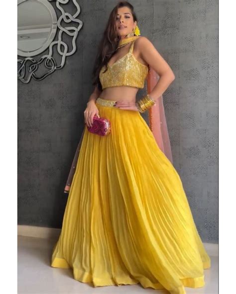 Buy Yellow Georgette Flared Embellished Lehenga Choli