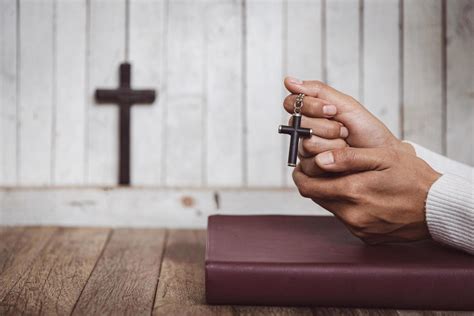 Hand of woman while praying for christian religion, Casual woman praying with her hands together ...