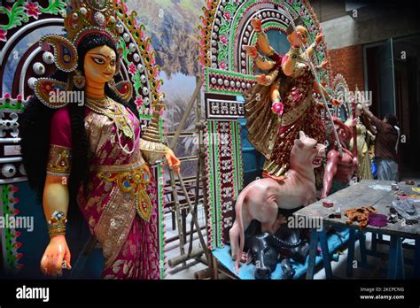 Artist Gives Final Touch To The Idol Of Hindu Goddess Durga During