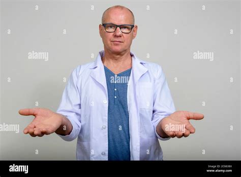 Portrait Of Mature Handsome Man Doctor With Eyeglasses Stock Photo Alamy