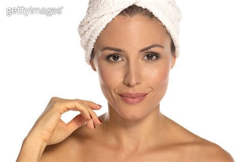 Beauty Portrait Of A Cheerful Attractive Half Naked Woman With A Towel