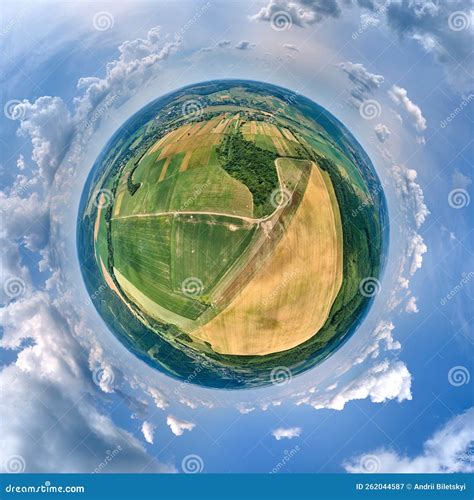 Aerial View From High Altitude Of Little Planet Earth With Green And