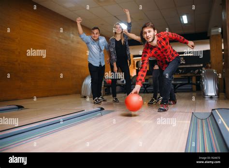 Male Bowler Throws Ball On Lane Strike Shot Bowling Alley Teams