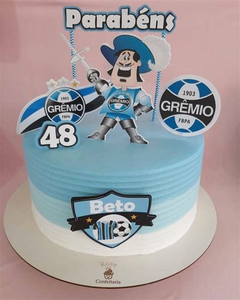 A Birthday Cake With An Image Of A Soccer Player On The Front And Blue