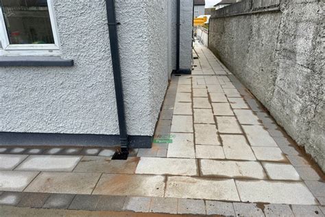 Patio With Newgrange Granite Slabs And Black Granite Borderline In