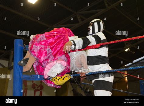 Male and female wrestlers in combat at the Cholitas Wrestling Event, El ...