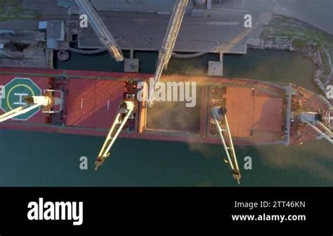 Close View Of Ship Loading Grain Crops On Bulk Freighter Via Trunk To