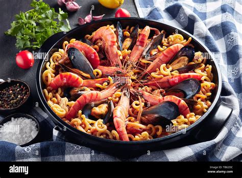 Spanish Fideua A Noodle Paella With Seafood King Prawns White Fish