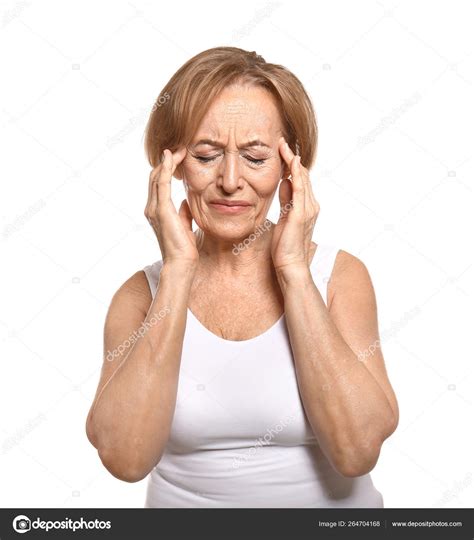 Beautiful Mature Woman Suffering From Head Ache Against White