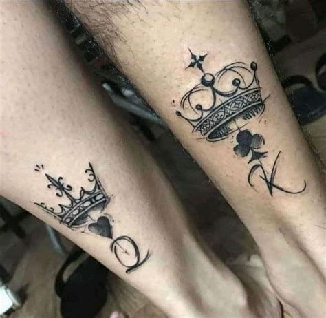 Two People With Tattoos On Their Legs And One Is Wearing A Tiara While