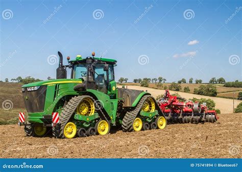 Modern John Deere Caterpilla Tractor Cultivating English Crop Field