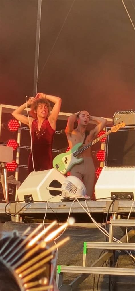 Two Women On Stage With Guitars And Microphones