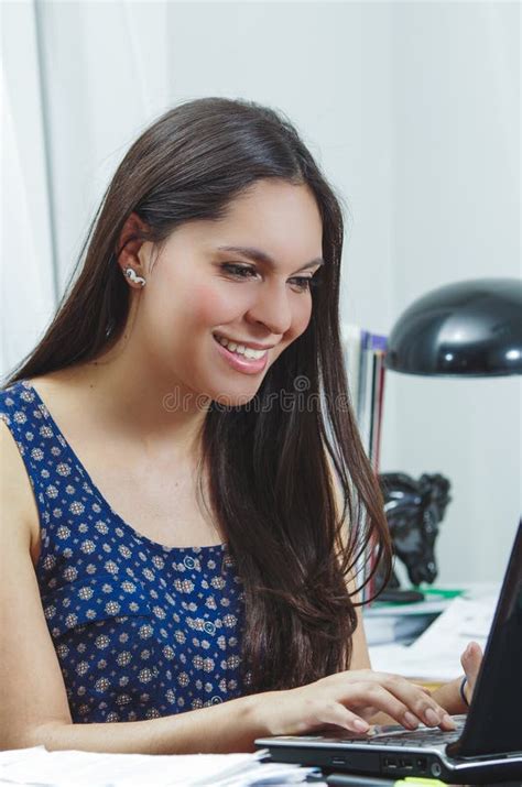 Hispanic Brunette Office Woman Sitting By Desk And Stock Image Image