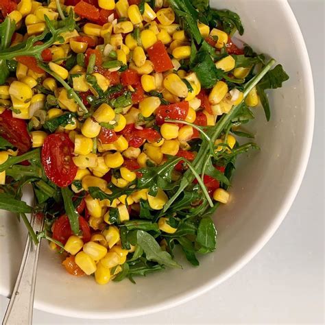 Arugula Salad With Tomatoes Scallion Corn And Chipotle Lime Vinaigrette Arugulasalad