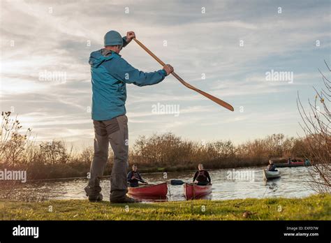 Mature Man Demonstrating Using An Oar Stock Photo Alamy