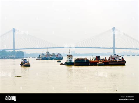 Boats On The Hooghly River Kolkata India With The Vidyasagar Setu