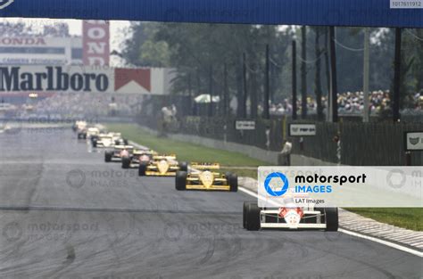 Ayrton Senna McLaren MP4 4 Honda Leads Nelson Piquet Lotus 100T