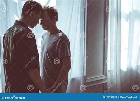 Loving Gay Couple Having Private Intimate Moment At Home Stock Image