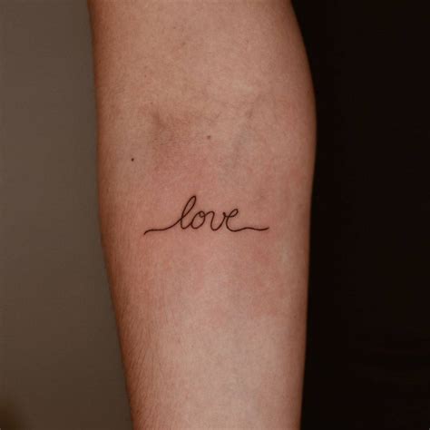 Love Lettering Tattoo On The Inner Forearm