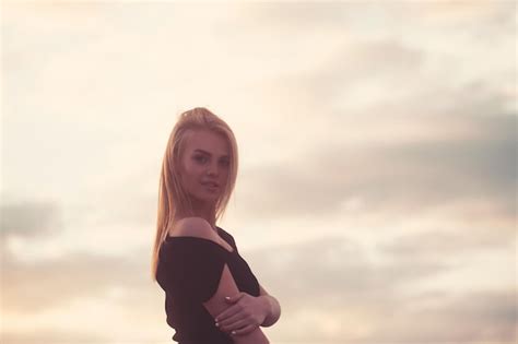 Premium Photo Beautiful Blonde Model In Black Dress Standing On The