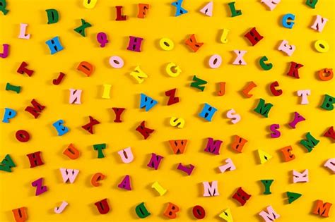 Premium Photo | Colorful letters of the English alphabet on a yellow ...