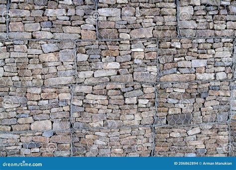 Metal Cage Filled With Rocks Texture Stone Wall With Metal Grid As Background Gabion Net