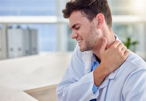 Tired Man Doctor With Neck Pain In Office Overworked Burnout Or Stress