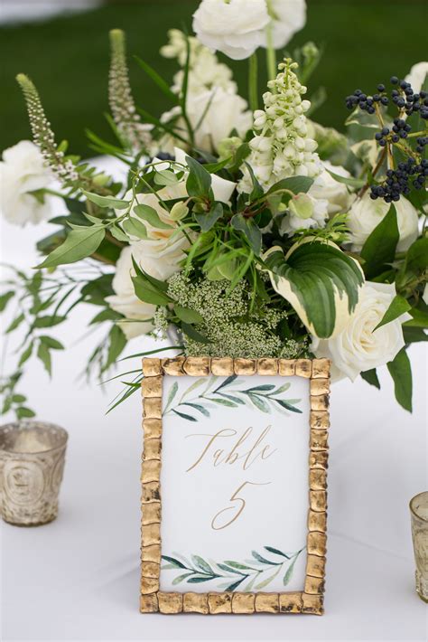 Elegant Green and White Flower Arrangements with Framed Greenery Table ...