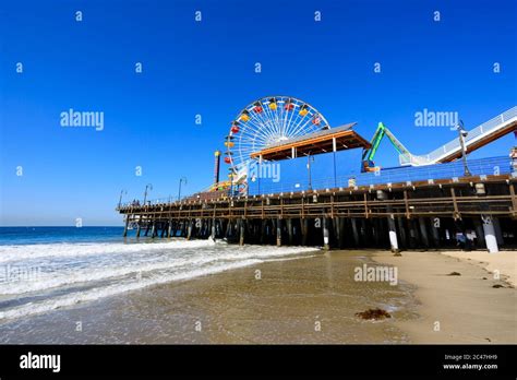 Ocean Park Amusements Roller Coaster And Ferris Wheel On The Pier