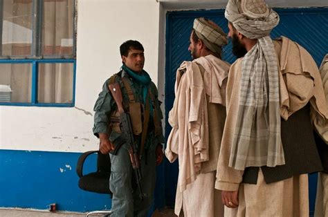 An Afghan Uniformed Police Officer Checked Local Villagers Nara