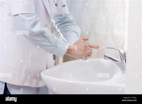 Female Doctor Hand Washing In The Sink With Soap Foam Stock Photo Alamy