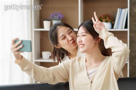 Asian Lesbian Couple Lgbtq Lesbian Couple Holding Smartphone And