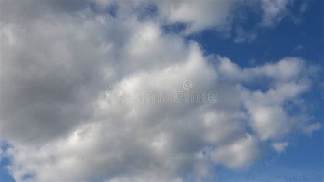 Stunning Cloud Formations With Sunlight Breaking Through Over A Vast