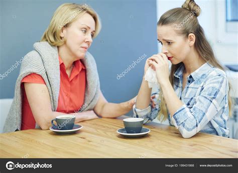 Woman Supporting Her Friend While Drinking Coffee Stock Photo