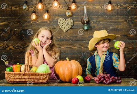 Celebrate Harvest Festival Children Presenting Harvest Vegetable