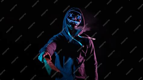 Premium Photo | Man with the mask of the purge with black background