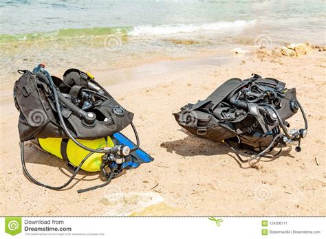 Equipment Of A Scuba Diver An Oxygen Balloon Lies On The Beach Diving