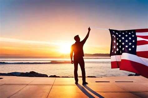 Premium Photo A Man Holds A Flag On A Pier With The Sun Setting