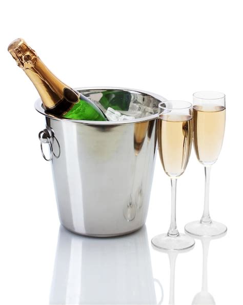 Premium Photo Champagne Bottle In Bucket With Ice And Glasses Of