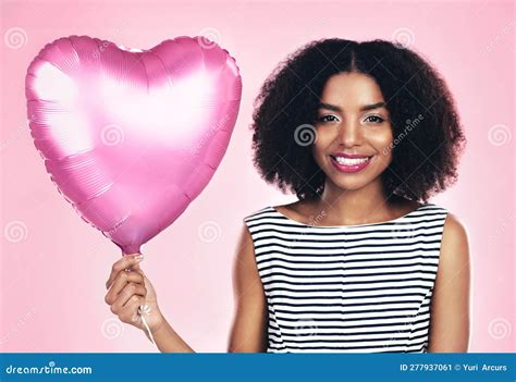 Im In A Romantic Mood A Young Woman Holding Up A Heart Shaped Balloon Stock Image Image Of