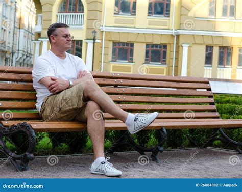 Man Sitting Waiting On An Urban Bench Stock Photo Image Of Resting