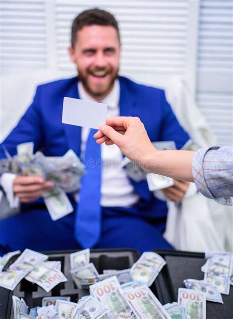 Excited Successful Businessman Opened A Box With Money And Rejoices In