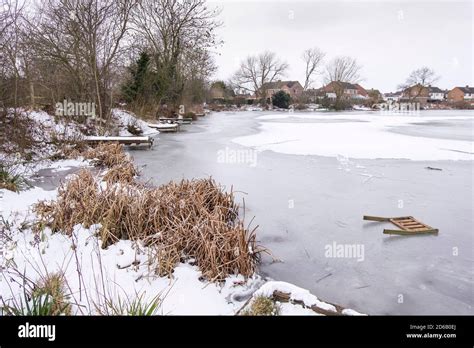 Frozen over fishing lake image Stock Photo - Alamy