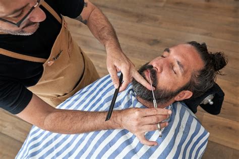 Premium Photo High Angle Of Crop Hairdresser With Scissors Cutting