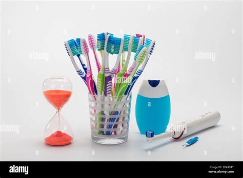 Hourglass Many Toothbrushes In Toothbrush Cup Mouthwash Electric