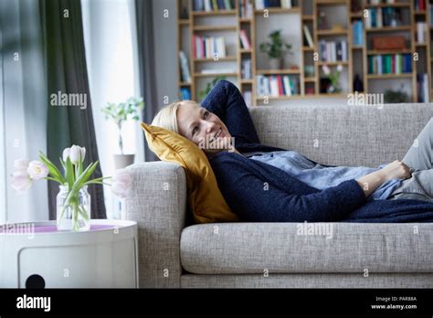 Blonde Woman Lying On Couch Hi Res Stock Photography And Images Alamy