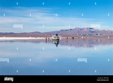 Water Mirror In Salar De Uyuni Uyuni Bolivia Tourists Reflects In